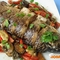 Рыба, запеченная под овощами